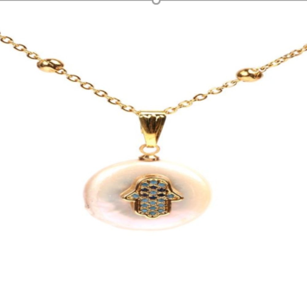 Hamsa Necklace on a Shell